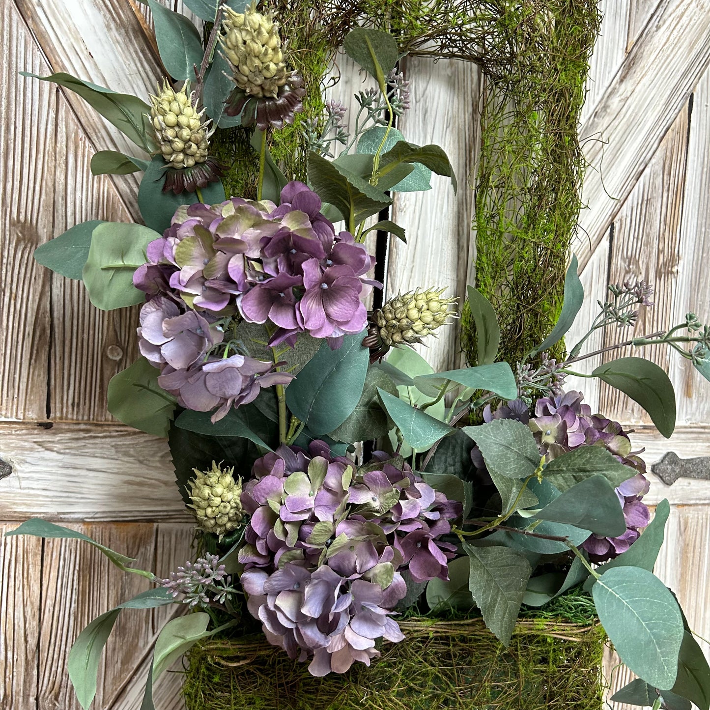 Close up photo showing the beautiful pale lavender colored hydrangeas with touches of pale green.